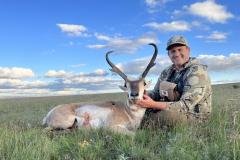 Hunter with harvested pronghorn antelope on a guided New Mexico hunt